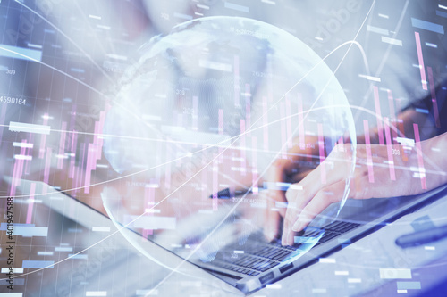 Double exposure of woman hands typing on computer and forex chart hologram drawing. Stock market invest concept.