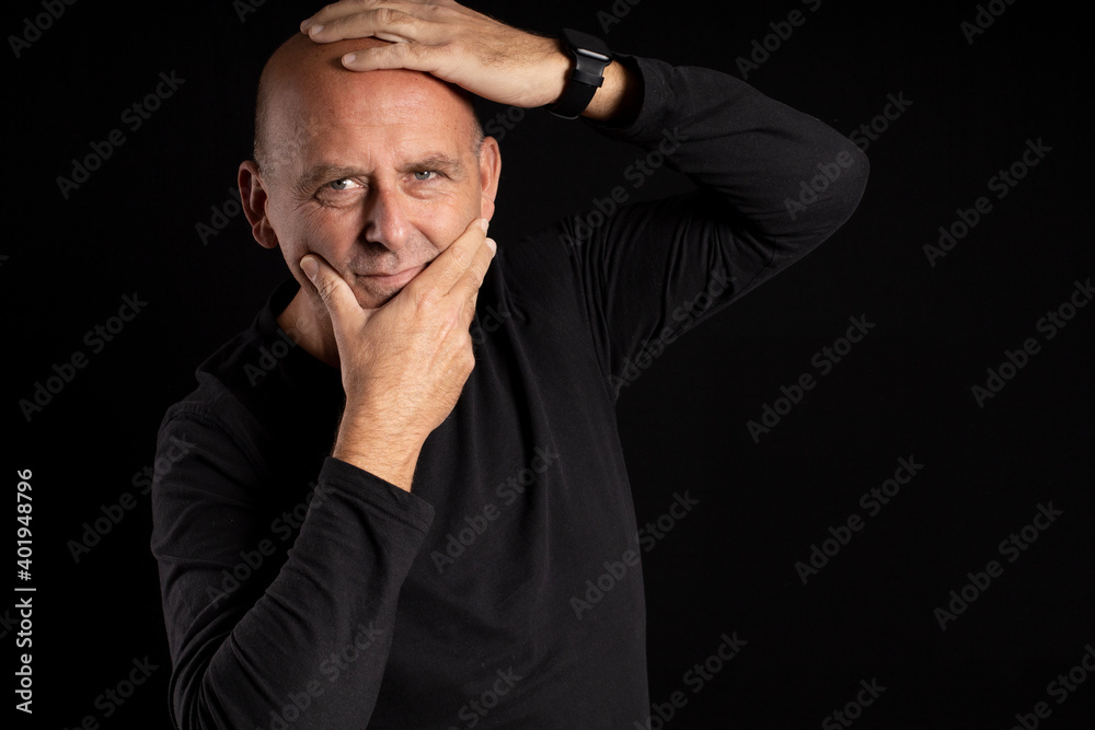 portrait middle aged man with light eyes on black background portrait middle aged man with light eyes on black background