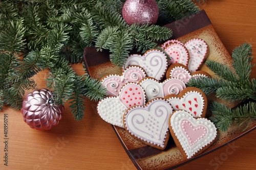 Various shaped Christmas gingerbreads with spruce branches photo