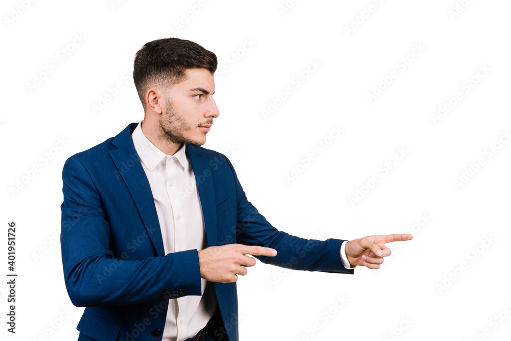 Young businessman dressed in an elegant suit pointing with both hands in profile isolated on a white background Young businessman dressed in an elegant suit pointing with both hands in profile isolated on a white background