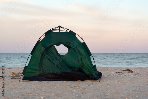 Tent by the sea at sunset. Tracking. Leisure. Outdoor.