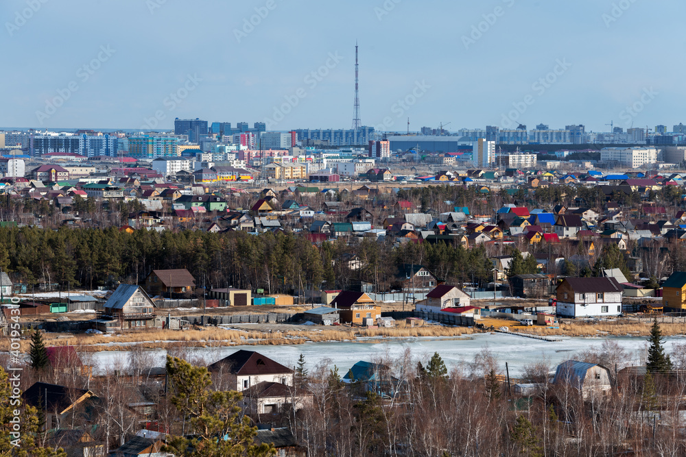 Obraz premium Aerial view of Yakutsk skyline with TV tower and center of the city in the evening