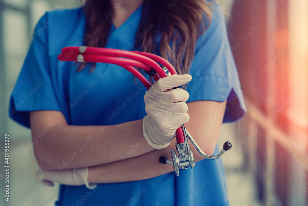Female doctor holding a stethoscope in hands