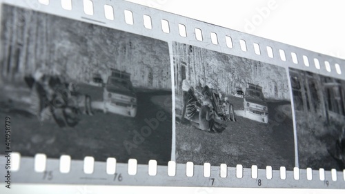 Wallpaper Mural Watching Retro Pictures on Negative Plastic Film Strip Torontodigital.ca