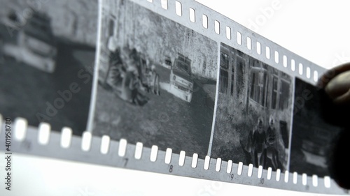 Wallpaper Mural Watching Retro Pictures on Negative Plastic Film Strip Torontodigital.ca