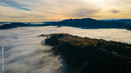 mountains tops high above clouds fog