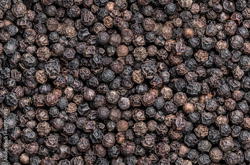 Seamless endless pattern of black pepper corn photo