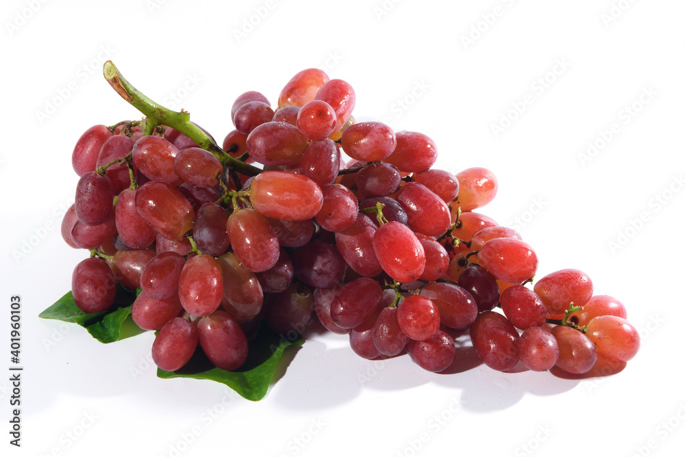 Fresh grapes and purple grape juice on the White background./Bunch of Grapes with water dropletsr