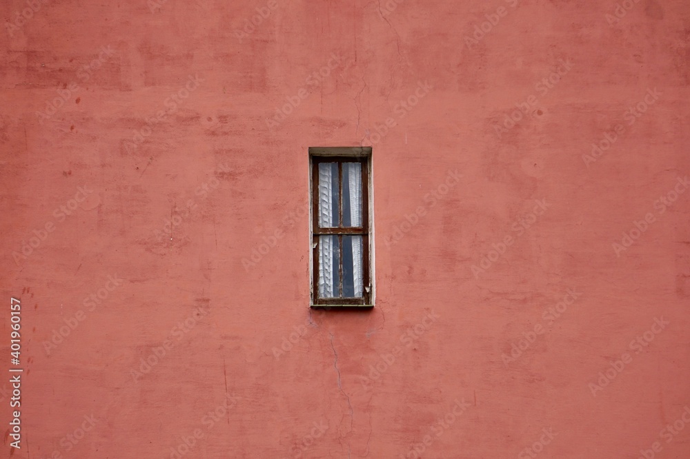 window on the red facade of the house, bilbao city architecture