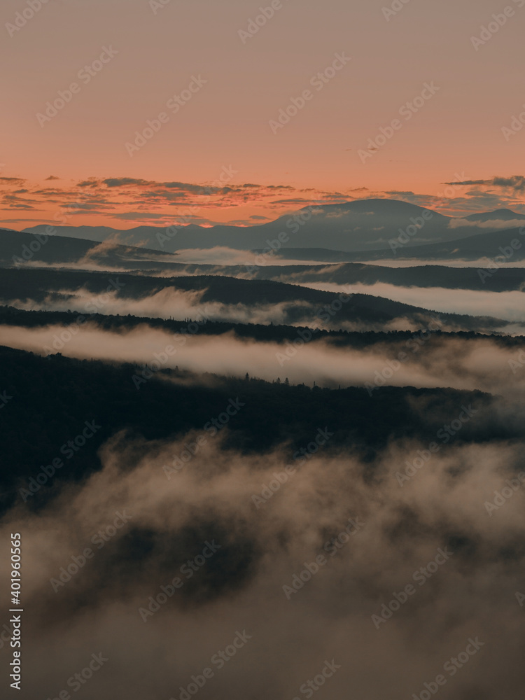 magic sunrise in the mountains above the clouds
