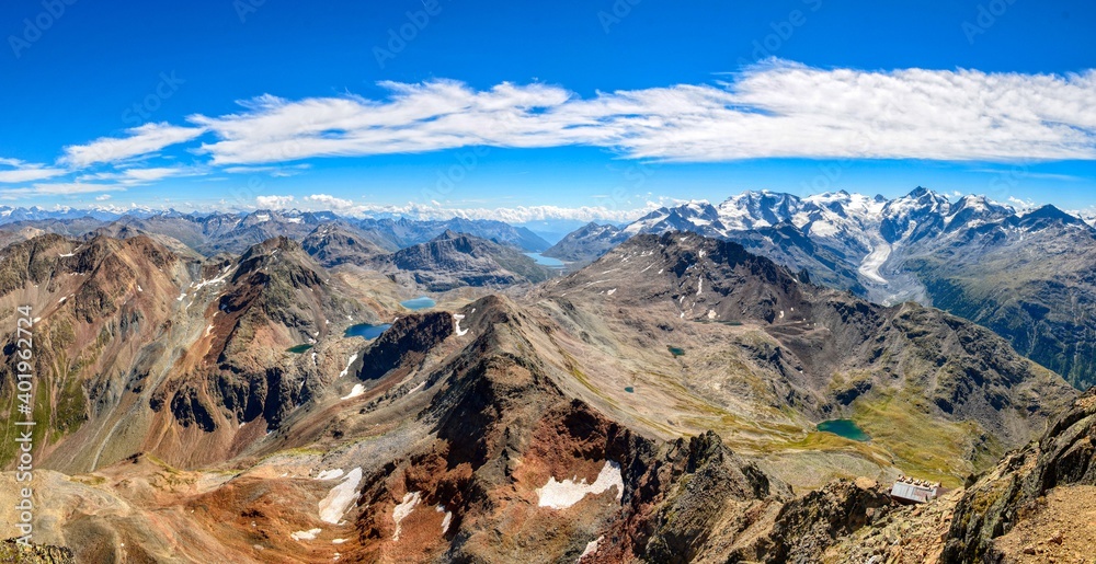 Mountain panorama in the engadin from Piz Languard. View of the large Morteratsch glacier, Piz Bernina and many mountain lakes, gigantic view, peak