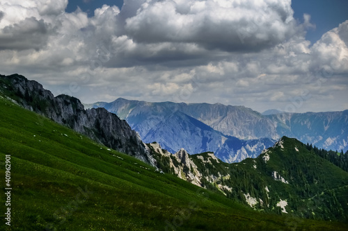 beautiful mountain range and large white clouds on the sky