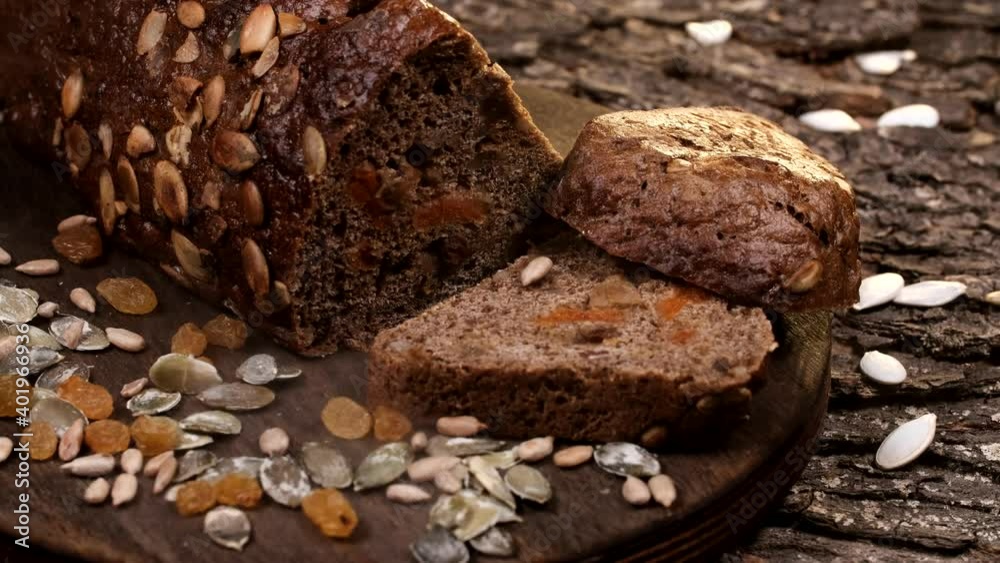 wholegrain rye bread slices with raisins, prunes and seeds. on a