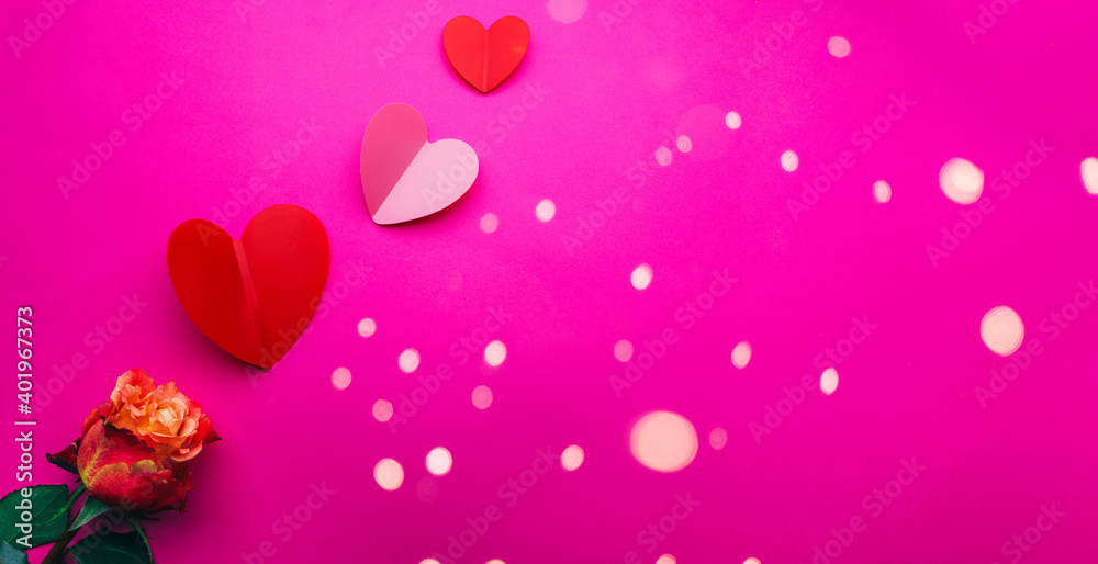 Paper origami hearts with rose flower on pink background Paper origami hearts with rose flower on pink background