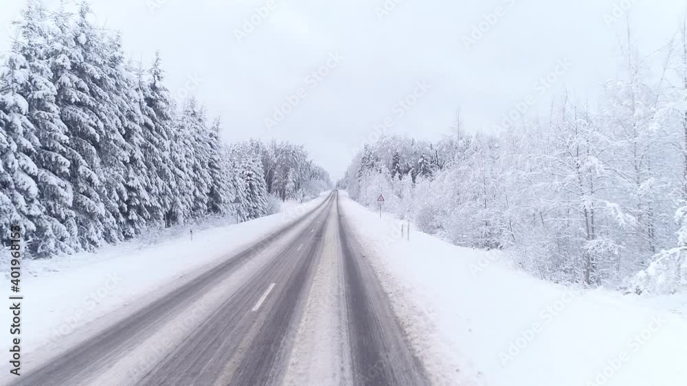 Snowfall covered the road and trees with a layer of snow. Beautiful drone flight in winter Snowfall covered the road and trees with a layer of snow. Beautiful drone flight in winter