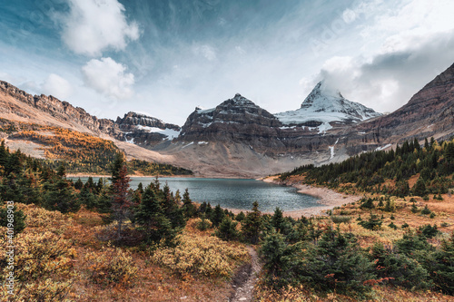 Scenery of Mount Assiniboine with Lake Magog in autumn forest at provincial park