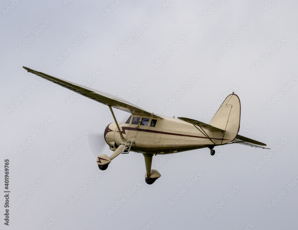 Fototapeta premium Vintage single engine monoplane at take off.