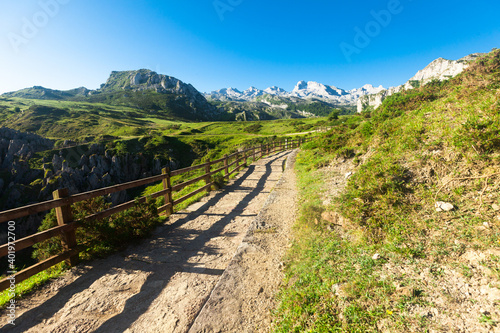 view with a wooden walkway to national park peaks of europe