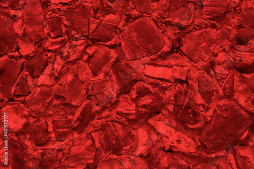 Abstract background of many large stones. The empty stone surface is red. Blank for design.