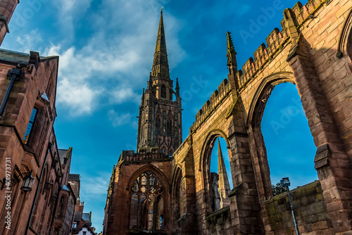 The spires and arches of the ruins of St Michaels Cathedral in Coventry, UK photo