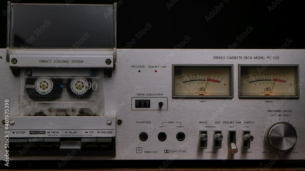 Vintage cassette player deck from 80s. Stereo recorder with rotating