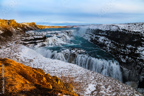 Early sunset over big waterfall in Iceland. © Tim