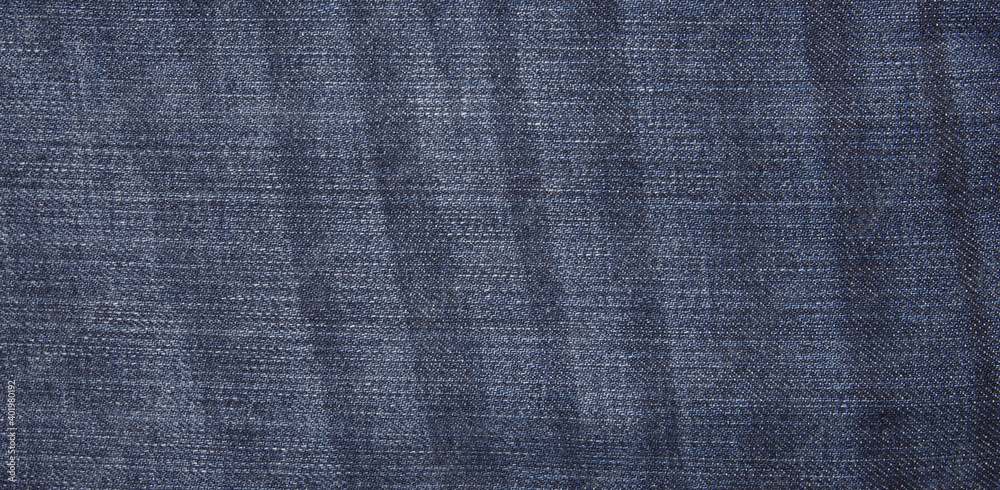 Textile - Fabric Series: Blue Jeans, Close-ups of Details of a pair of jeans trousers Fabric Background Textile - Fabric Series: Blue Jeans, Close-ups of Details of a pair of jeans trousers Fabric Background