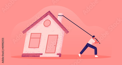 The man pulls the house with him. Real estate, personal property ownership, private home. Problems with housing, buying a house. House for sale. Moving, change of residence