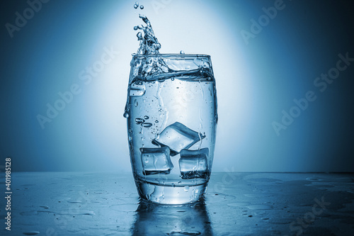 A glass of water with ice cubes.