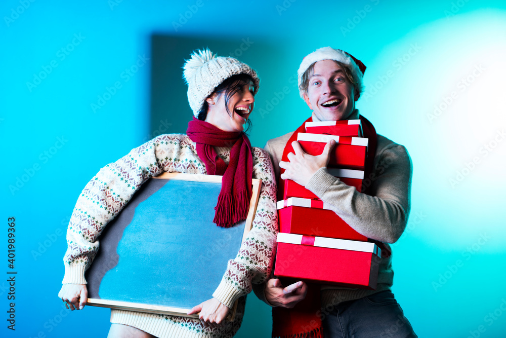 Obraz premium Winter couple. Christmas couple. Gifts. Holidays. Sensual. Man and woman. 