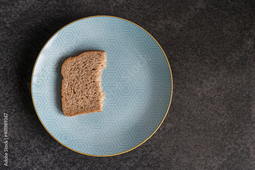 Half a slice of bread on a plate