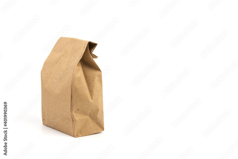 paper disposable bag of brown kraft paper on white background, concept of rejection of plastic packaging, template for designer, packaging for contactless product delivery paper disposable bag of brown kraft paper on white background, concept of rejection of plastic packaging, template for designer, packaging for contactless product delivery