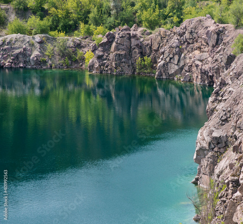 Emerald lake with rocky shores