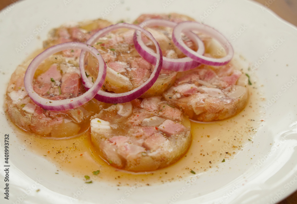 white collared pork with onion rings in vinegar an oil