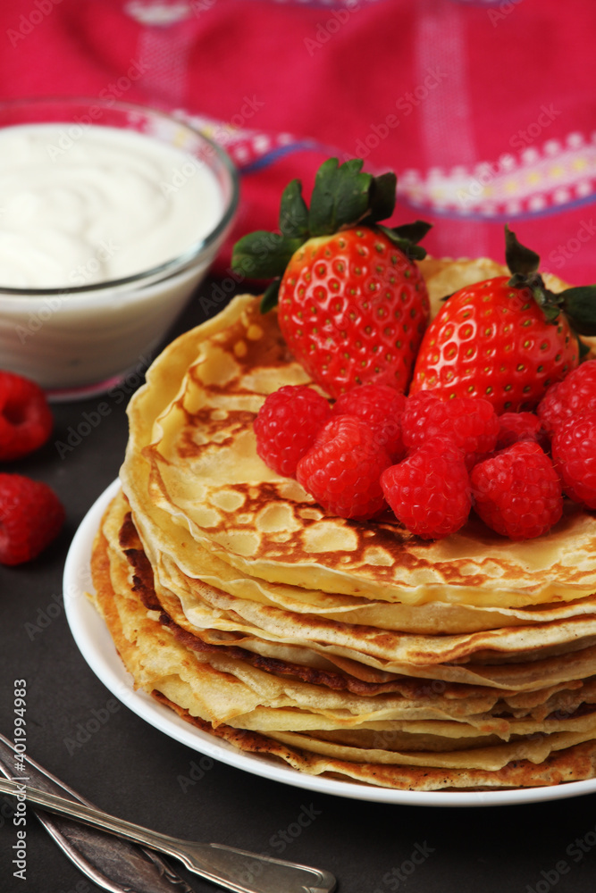 Russian cuisine national dish bliny with fresh berries Russian cuisine national dish bliny with fresh berries