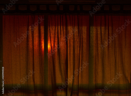 Photos A closeup shot of windows closed with retro curtains at the sunset time - comfor