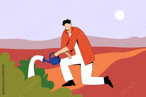 Character man with a watering can in his hand watering the bushes in the evening. A gardener in a white suit and red shirt tending the plants. Agronomist in the fields.