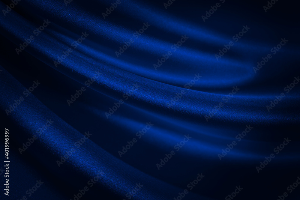 Black blue abstract background. Dark blue silk satin texture background. Shiny fabric with wavy soft pleats. Dark blue elegant background with copy space for your design. Liquid wave effect.