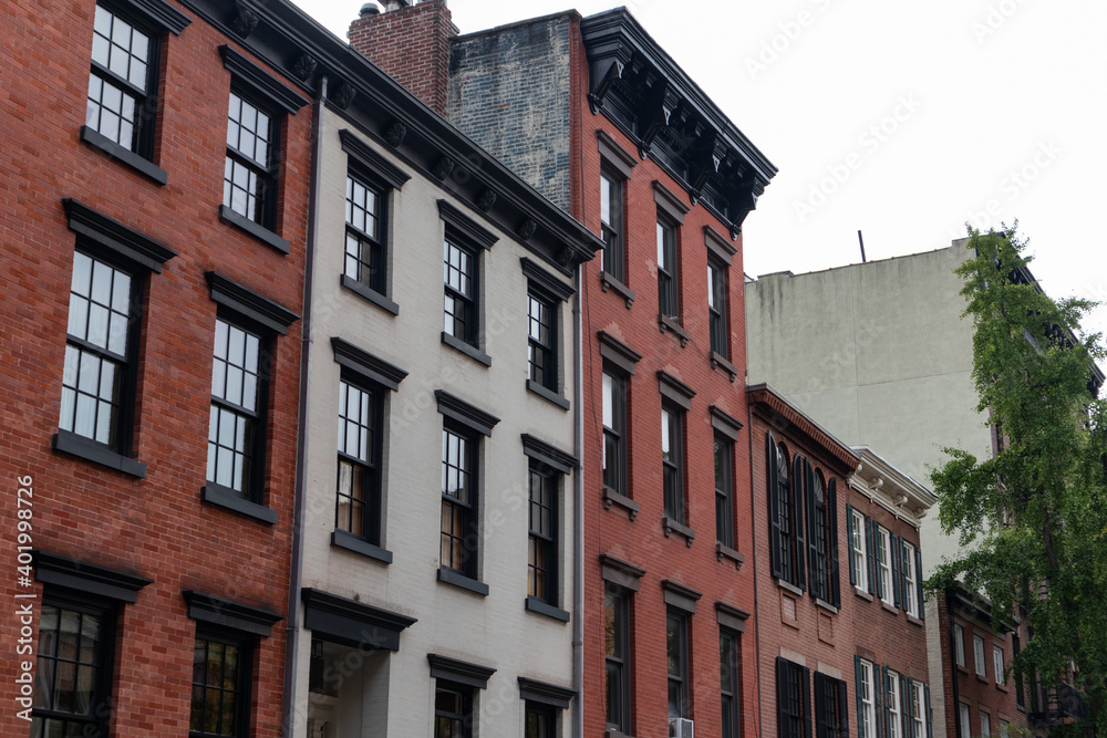 Row of Old Colorful Brick Apartment Buildings in Greenwich Village of New York City