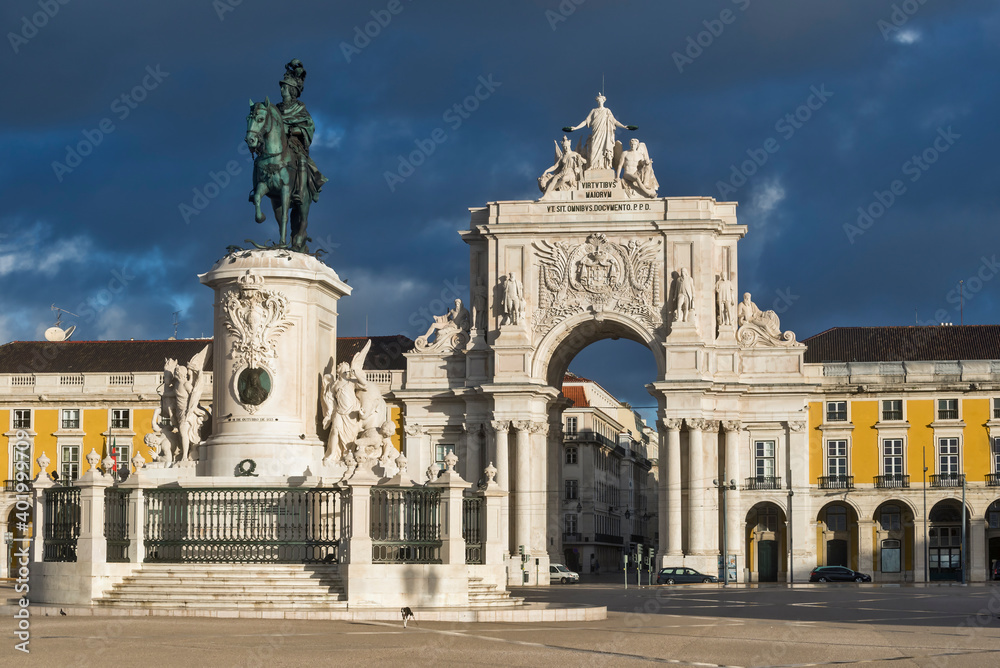 Praca do Comercio Square with triumphal arch, statue of King José I and traditional architecture in Lisbon, Portugal