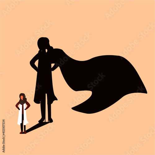 A woman standing and her shadow showing as superwoman. Women should be considered as strength not weakness, this is true for every woman in this world. 