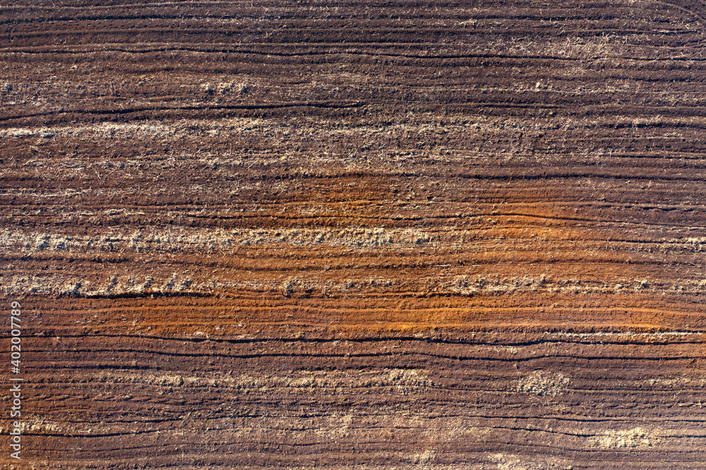 Fototapeta premium Agricultural field with clay soil, aerial view.
