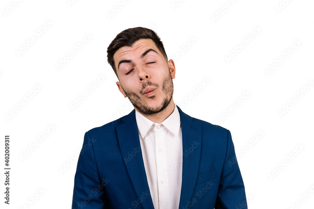 young man with dark hair dressed in a suit making a funny expression with his face isolated on a white background young man with dark hair dressed in a suit making a funny expression with his face isolated on a white background