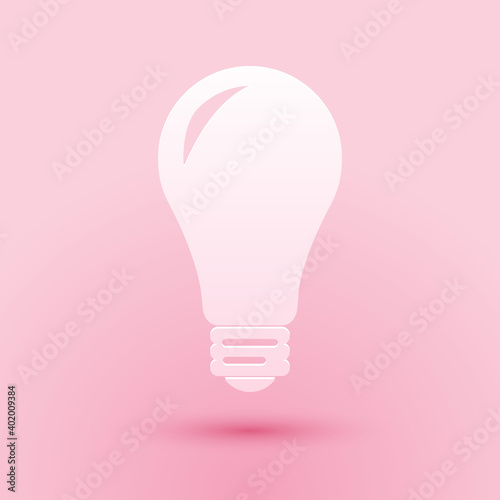 Paper cut Light bulb icon isolated on pink background. Energy and idea symbol. Lamp electric. Paper art style. Vector.