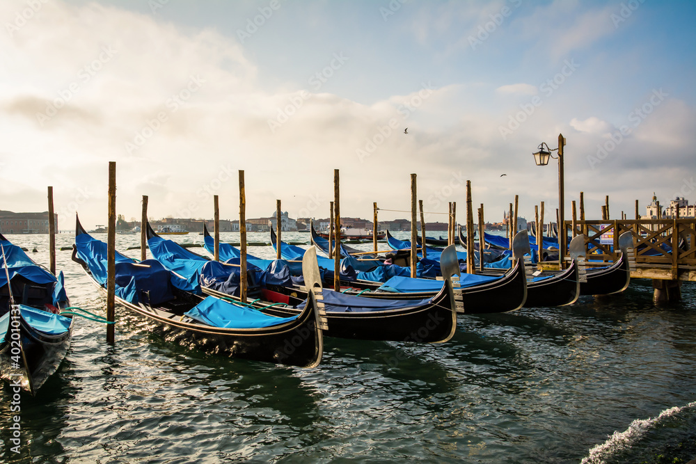 Gondolas moored outside St. Mark’s Square in Venice Italy