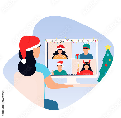 Happy New Year online party. Woman wearing Santa hat is greeting to friends on virtual zoom video call.