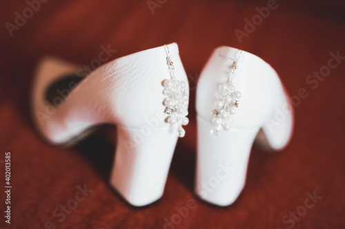 White stylish wedding shoes for bride. Close-up