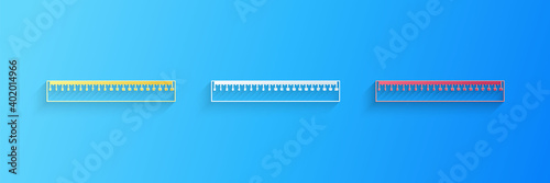 Paper cut Ruler icon isolated on blue background. Straightedge symbol. Paper art style. Vector.