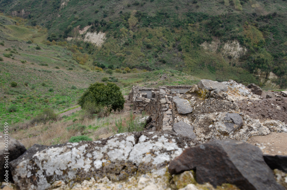 landscapes with mountain views with the remains of ancient buildings on the Golan heights in israel