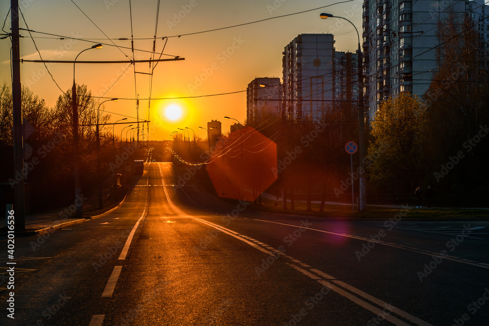 Sun setting over the empty street in Yasenevo district in Moscow